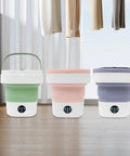 Hella Efficient Compact Foldable Mini Washer With Slick Drainage Setup And Pure Copper Motor Plus Gentle Handwash Simulation For Delicates And Baby Clothes Green Finish displayed in green, pink, and purple colors.