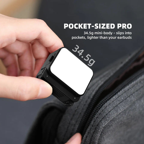 Hand holding Lil Portable Mini LED Video Light For Action Cameras With Cold Shoe And Quick Release Mounts, 34.5g lightweight design.