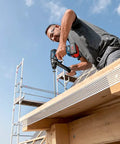 Man using 18V Cordless Combi Drill with 150 Nm Torque Brushless Motor Pro Grade Power Tool on construction site.