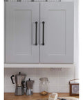 10 Pack Matte Black Kitchen Cabinet Pulls 5 Inch Center To Center 128mm Zinc Alloy Solid Round Drawer Handles installed on grey cabinet
