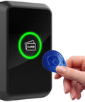 Hand holding a key fob near a 125KHz RFID Card Reader With Wiegand 26 Bit Or Wiegand 34 Bit For Door Access Control System Outdoor IP66 Waterproof Buzzer