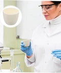 Scientist holding white ceramic crucible in lab, inset shows close-up of Graphite Lab Crucibles For Casting And Refining, Heavy Duty Reusable Crucibles For Copper And Metal Smelting, Aluminum Oxide White, Durable Laboratory Cup Pots For Smelting And General Laboratory Use.