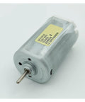 Heavy Duty DC 120V Electric Motor With Beefy Torque Output Runs Ultra Smooth Low Noise Design Built Like A Tank With Dust Resistant Housing For Non Stop Industrial Grind, close-up view showing metal casing and shaft.