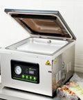 Pro Grade Chamber Vacuum Sealer Packs A Solid Punch With Sturdy 16 Inch Seal Bar And Whisper Quiet Motor on kitchen counter.