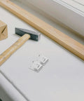 8 Pack Stainless Steel Freezer Shelf Clips With Brushed Finish by tools and a wooden beam on a table