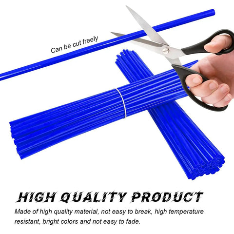 Cutting dark blue spoke covers for dirt bikes motorcycle spoke skins wheel wraps for 8 to 21 inch rims with scissors in action.