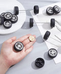 Rad 16 Pack Toy Car Wheels Set With 8 Shaft Axles for RC Cars, showing wheels and axles on a table, one wheel in hand.