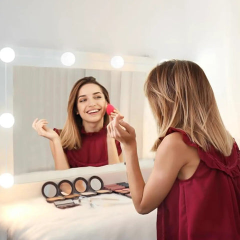 Woman using Hollywood Style LED Vanity Mirror Lights With 14 Dimmable Bulbs USB Powered Stick On Lights for makeup table