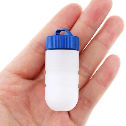 Two Color Scuba Dive Signal Light Four Modes Blue And Red Constant And Flashing Mini Tank Marker Light held in hand.