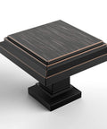 Close-up of Oil Rubbed Bronze Square Cabinet Knob from 10 Pack, zinc alloy hardware pull for furniture, modern kitchen update.
