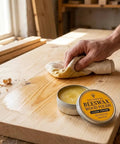 Real Deal Natural Beeswax Furniture Polish To Restore Dry Wood And Boost Natural Grain With Food Safe Olive Oil Blend For A Smooth Clean Finish That Gives Your Favorite Wooden Pieces Brand New Life In 3.5 Fl Oz Jar being applied to a wooden surface.
