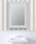 Top Shelf Vinyl Wallpaper Featuring Subtle Leather Grain And Eclectic Funky Patterns in a bathroom with a white sink and mirror.