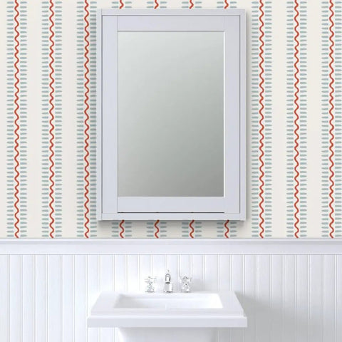 Top Shelf Vinyl Wallpaper Featuring Subtle Leather Grain And Eclectic Funky Patterns in a bathroom with a white sink and mirror.