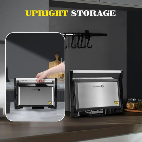 Aigostar 1200W Panini Press Sandwich Maker With Ceramic Non Stick Plates Opens 180 Degrees For Indoor Grilling Stainless Steel Removable Drip Tray Silver Compact Kitchen Appliance For Quick Meals in upright storage position.