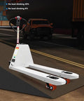 Heavy Duty Manual Pallet Jack With 1500 Kg Capacity, Robust Alloy Steel Frame, Silent Slip Resistant Wheels, Electric Forklift Style Lifting Tool For Warehouse Material Handling And Smooth Transport On Cement Floors on an incline.