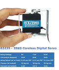 Hand holding 35Kg Coreless Robot Servo with 8.4V beefy torque and steel gear digital steering for RC vehicles, includes mount bracket.