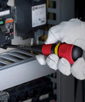 Gloved hand using Ball Grip Magnetic Ratchet Screwdriver With Ergonomic Handle on electrical panel
