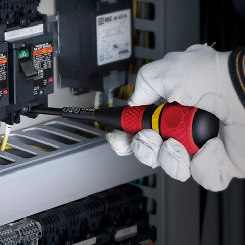 Gloved hand using Ball Grip Magnetic Ratchet Screwdriver With Ergonomic Handle on electrical panel