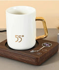 Smart Cup Heater And Mug Warmer With Three Adjustable Levels And Auto Timing Off keeps coffee warm on a chocolate heating coaster.