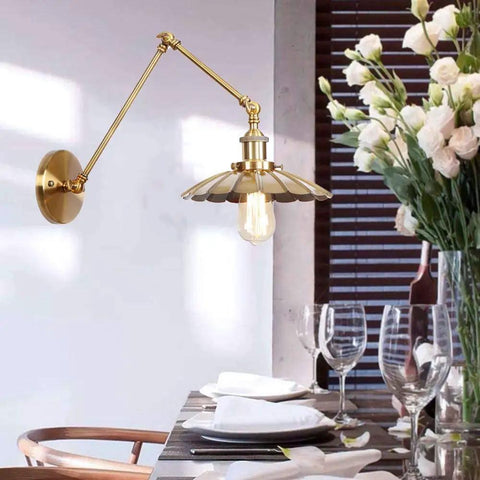 Badass Heavy Duty Swing Arm Wall Lamp, Adjustable Bronze Sconce, vintage fixture illuminating dining table with elegant decor.
