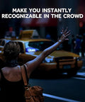 Person hailing a taxi at night with bright blue LED car light sign visible in background, enhancing high visibility in the crowd