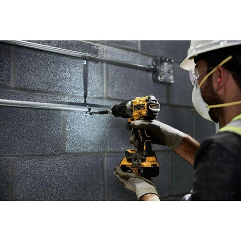 Worker using Compact 1/2 Inch Cordless Hammer Drill With Brushless Motor 2 Speed Settings Bare Tool High Bit Retention in tight spaces