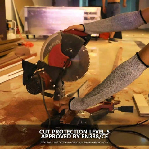 Person using 18 Inch Cut Resistant Sleeves Set For Kitchen And Outdoor Work Grade 5 Anti Cut Knit Arm Covers, operating a saw.