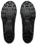 Underside view of X Alp Mesa Mountain Bike Shoe For Men Black Size 45 showing grippy rubber sole and SPD 2 bolt cleat compatibility