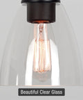 Close-up of clear glass lamp shade from 3-Pack Modern Cone Shape 6x5.75 Inch 1-5/8 Inch Fitter with Edison bulb