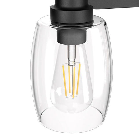 Close-up of clear glass shade detail on 4 Lights Black Vanity Light Fixtures Over Mirror With Clear Glass Shades Industrial Vibe Wall Sconce For Bathroom Dimmable With E26 Socket Compatible With LED Incandescent And Energy Saving Bulbs.