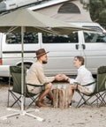 Couple under Super Tough Foldable Portable Beach Umbrella Stand Built For Sand And Grass As Patio Base Holder With Adjustable Fit Thick Rust Free Iron For Easy Pool Setup And Outdoor Days on sand