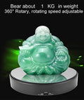 Mirror Surface Motorized Turntable Display Stand With 360 Degree Rotary Motion And Adjustable Speed showcasing a jade Buddha figurine.