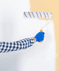 Person using the Superior Quality Reusable Paint Roller Brush Set With Thick Fiber Padding And Comfort Grip Handles for wall painting.