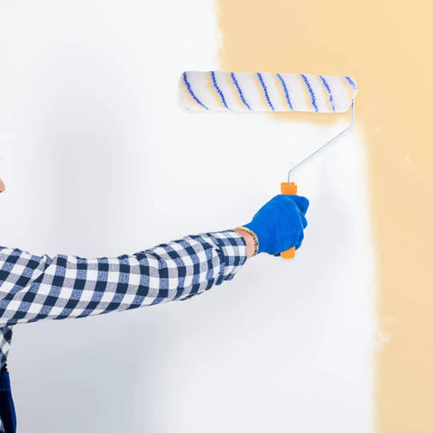 Person using the Superior Quality Reusable Paint Roller Brush Set With Thick Fiber Padding And Comfort Grip Handles for wall painting.
