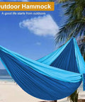 Heavy Duty Camping Hammock With 660Lb Capacity And Tree Straps Portable Outdoor Tent on beach with blue sky