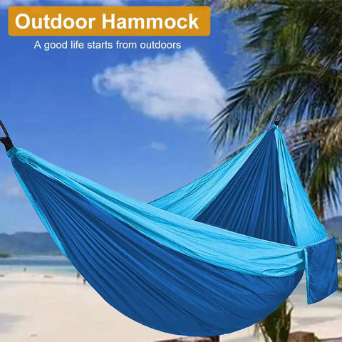Heavy Duty Camping Hammock With 660Lb Capacity And Tree Straps Portable Outdoor Tent on beach with blue sky