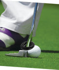 Close-up of a black Two Pack Weighted Golf Swing Trainer Ring on a putter with a golf ball, enhancing swing power and stability.