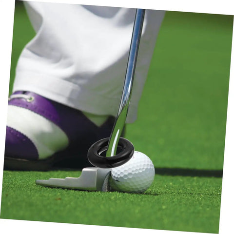 Close-up of a black Two Pack Weighted Golf Swing Trainer Ring on a putter with a golf ball, enhancing swing power and stability.