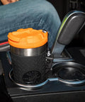 Stainless Steel Tumbler with Flip Top Lid 20 Oz Insulated Double Wall Vacuum Mug in car cup holder with slip resistant sleeve.