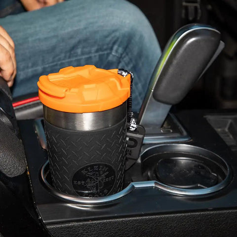Stainless Steel Tumbler with Flip Top Lid 20 Oz Insulated Double Wall Vacuum Mug in car cup holder with slip resistant sleeve.