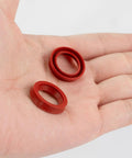 10 Pieces Silicone O Rings For Coffee Makers And Espresso Machines Seals Replacement Gaskets in red, shown on a hand