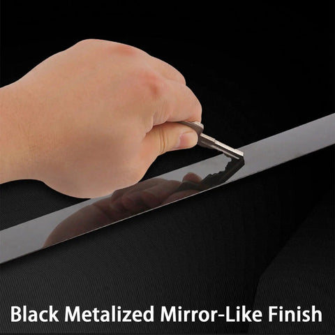 Close-up of hand peeling Slick Self Adhering Stainless Steel Black Metalized Wall Trim Molding With Mirror Like Finish.