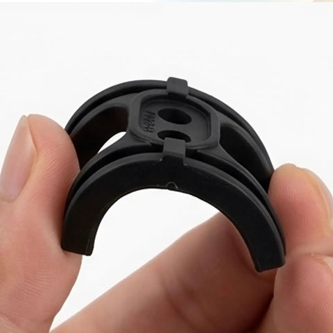 Hand holding a black 2 Pack Bike Bottom Bracket Cable Guide Set With Anti Friction Cable Holder for quiet, smooth gear shifting.