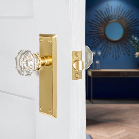 Crystal Door Knob With Plate In New York And Waldorf Style, brass back plate, on white door, classic home decor