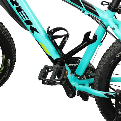 Close-up of a turquoise bicycle frame and pedal, featuring black elements and tire tread details.
