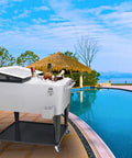 80 Quart Rolling Cooler Cart With Wheels Portable Wicker Beverage Bar Stand For Outdoor Patio Parties next to a pool.