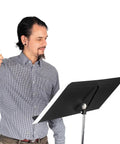 Conductor using Fourscore Music Stand With Extra Wide 32 Inch Desk For Large Scores And Ensembles Heavy Duty Aluminum Construction