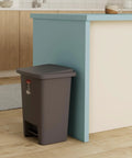 Gray step on trash can with lid 8.25 gallon by kitchen counter, compact design, quiet close, space-saving foot pedal bin
