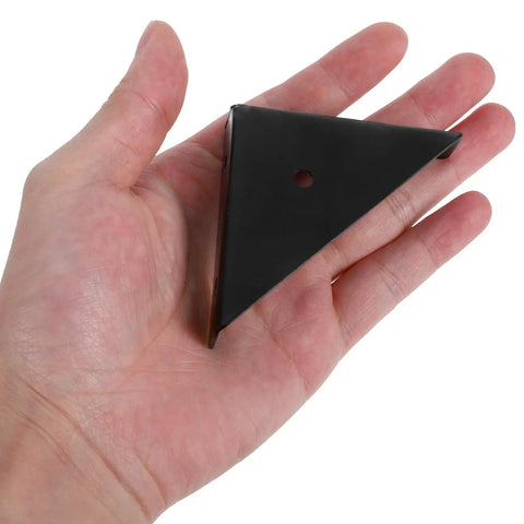 Hand holding a single bracket from the Beefy 12 Pack Black Triangular Shelf Brackets Made From Cold Rolled Steel For Wood Shelves Heavy Duty Corner Supports