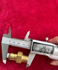 Close-up of brass thermal relief valve with 3/8 in NPT threads for a pressure washer pump; caliper shows about 42.5 mm.